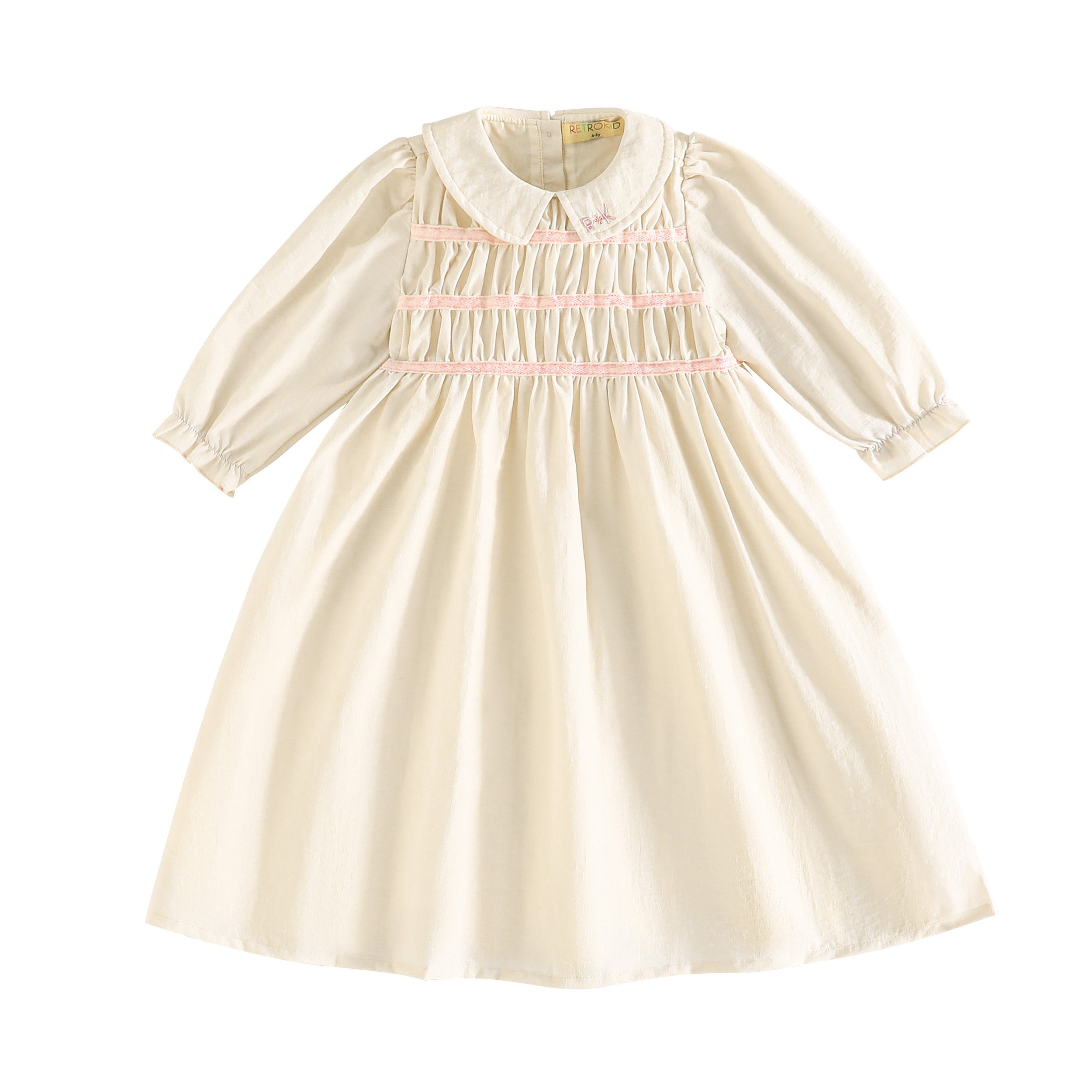 RetroKid Cream/ Pink Halston Smocked Dress - 3/4 Sleeve | Buttons Bebe RetroKid Cream/ Pink Halston Smocked Dress - 3/4 Sleeve | Buttons Bebe