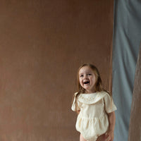 Popelin Off-white romper suit with embroidered bib collar (Mod.2.1)