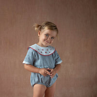 Popelin Blue romper suit with embroidered bib collar (Mod.2.3)